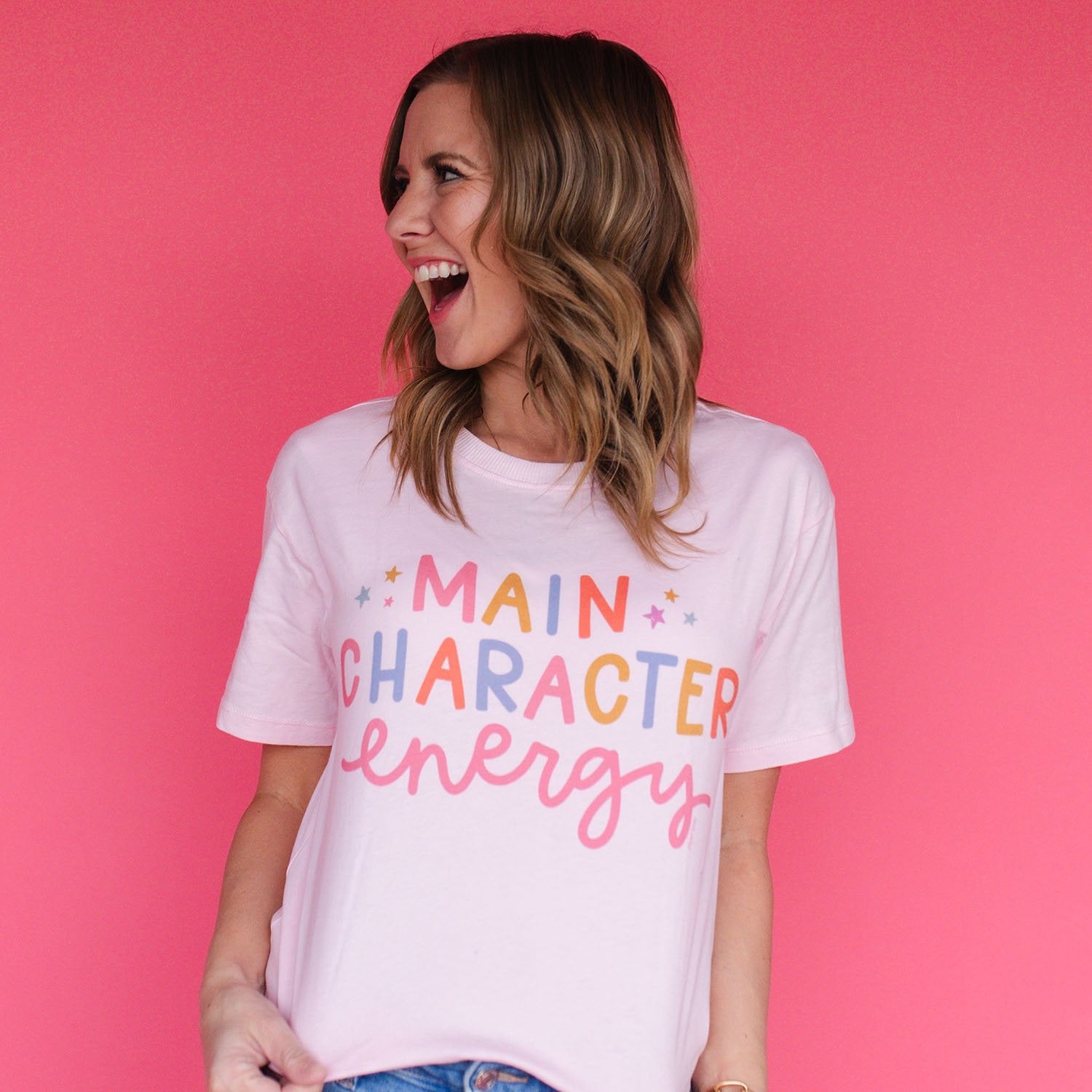 woman wearing main character energy t-shirt